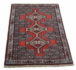 Backside of handmade New Senneh rug showing knot structure and weave density