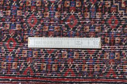 Corner detail of New Senneh rug showing border pattern and Wool pile