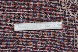 Corner detail of New Senneh rug showing border pattern and Wool pile