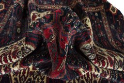 Corner detail of 1970s Senneh rug showing border pattern and Wool pile