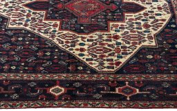 Close-up detail of 1970s Senneh rug from Iran / Persia showing Wool weave