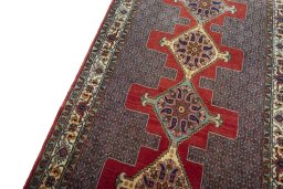 Backside of handmade New Senneh rug showing knot structure and weave density