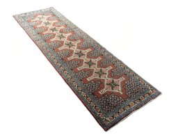 Close-up detail of 2000s Senneh rug from Iran / Persia showing Wool weave