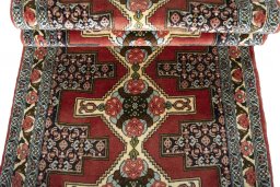Full view of 2000s Senneh rug from Iran / Persia, 302 × 92 cm in Red tones