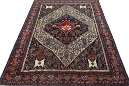Surface texture of 1930s Senneh rug with natural Wool and intricate pattern