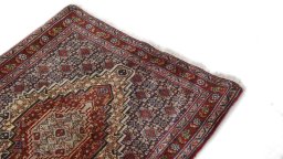 Surface texture of 1990s Senneh rug with natural Wool and intricate pattern