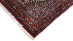 Backside of handmade 1990s Senneh rug showing knot structure and weave density