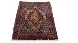 Close-up detail of 1990s Senneh rug from Iran / Persia showing Wool weave