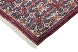 Backside of handmade 1990s Senneh rug showing knot structure and weave density