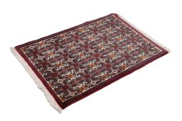Corner detail of 1990s Senneh rug showing border pattern and Wool pile