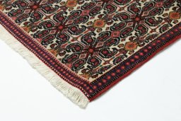 Backside of handmade 1990s Senneh rug showing knot structure and weave density