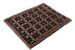 Corner detail of 1950s Senneh rug showing border pattern and Wool pile