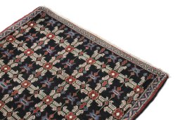 Surface texture of 1950s Senneh rug with natural Wool and intricate pattern