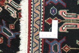 Close-up detail of 1950s Senneh rug from Iran / Persia showing Wool weave