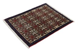Corner detail of 1960s Senneh rug showing border pattern and Wool pile