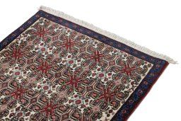 Surface texture of 1950s Senneh rug with natural Wool and intricate pattern