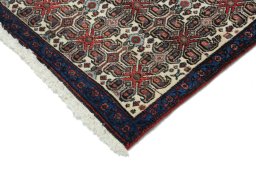 Backside of handmade 1950s Senneh rug showing knot structure and weave density