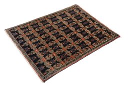 Corner detail of 1950s Senneh rug showing border pattern and Wool pile