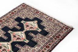 Surface texture of 1990s Senneh rug with natural Wool and intricate pattern