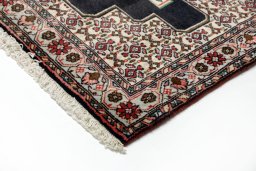 Backside of handmade 1990s Senneh rug showing knot structure and weave density