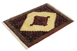 Corner detail of 1990s Senneh rug showing border pattern and Wool pile