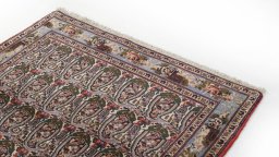 Surface texture of 1950s Senneh rug with natural Wool and intricate pattern