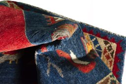 Corner detail of 2000s Shiraz rug showing border pattern and Wool pile