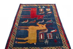 Surface texture of 2000s Shiraz rug with natural Wool and intricate pattern