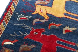 Backside of handmade 2000s Shiraz rug showing knot structure and weave density