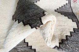 Corner detail of 2000s Shiraz rug showing border pattern and Wool pile
