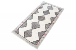 Corner detail of 2000s Shiraz rug showing border pattern and Wool pile