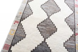 Backside of handmade 2000s Shiraz rug showing knot structure and weave density
