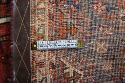Corner detail of 2000s Shiraz rug showing border pattern and Wool pile