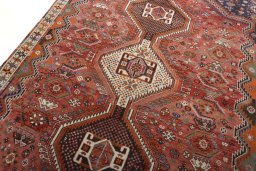 Surface texture of 2000s Shiraz rug with natural Wool and intricate pattern