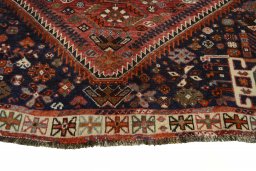 Backside of handmade 2000s Shiraz rug showing knot structure and weave density