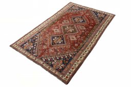 Corner detail of 2000s Shiraz rug showing border pattern and Wool pile