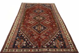 Surface texture of 2000s Shiraz rug with natural Wool and intricate pattern