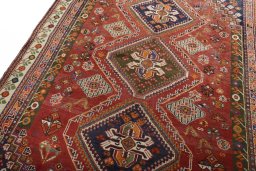 Backside of handmade 2000s Shiraz rug showing knot structure and weave density