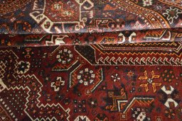 Corner detail of 2000s Shiraz rug showing border pattern and Wool pile
