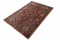 Corner detail of 2000s Shiraz rug showing border pattern and Wool pile