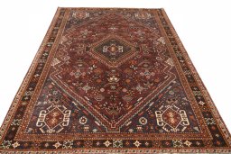Surface texture of 2000s Shiraz rug with natural Wool and intricate pattern