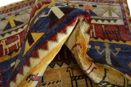 Corner detail of 2000s Shiraz rug showing border pattern and Wool pile