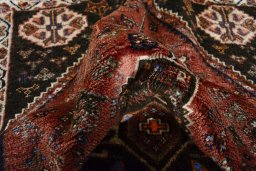 Close-up detail of 2000s Shiraz rug from Iran / Persia showing Wool weave