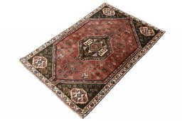 Corner detail of 2000s Shiraz rug showing border pattern and Wool pile
