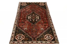 Surface texture of 2000s Shiraz rug with natural Wool and intricate pattern