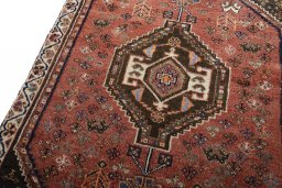 Backside of handmade 2000s Shiraz rug showing knot structure and weave density