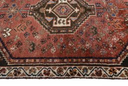Full view of 2000s Shiraz rug from Iran / Persia, 153 × 100 cm in Red tones