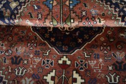 Corner detail of 2000s Shiraz rug showing border pattern and Wool pile