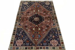 Surface texture of 2000s Shiraz rug with natural Wool and intricate pattern