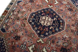 Backside of handmade 2000s Shiraz rug showing knot structure and weave density